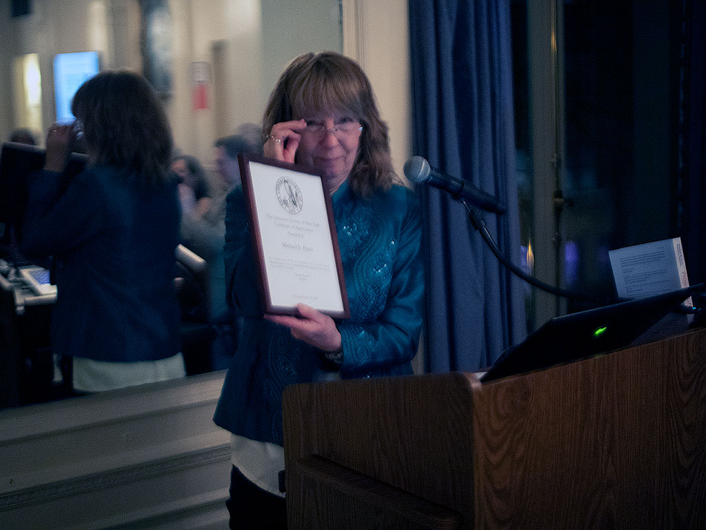 Barbara Saunders presenting a special honor to Mike Flynn, a member since 1937