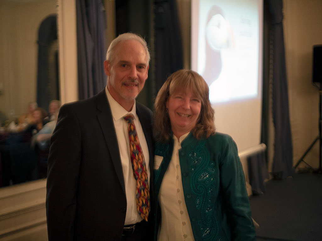 Barbara Saunders turning over the presidency of the Society to the newly elected President, Ken Chaya